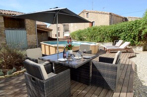 Dining area, swimming pool and loungers