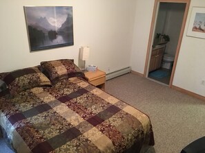 Bedroom with view to Master bathroom.  Also has a walkin closet