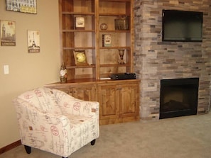 Living room features built-in cabinets next to the fireplace.