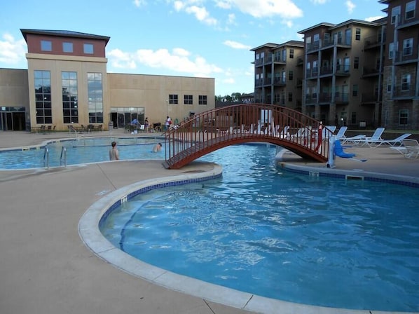 Large resort pool with separate areas and amenities for the entire family.