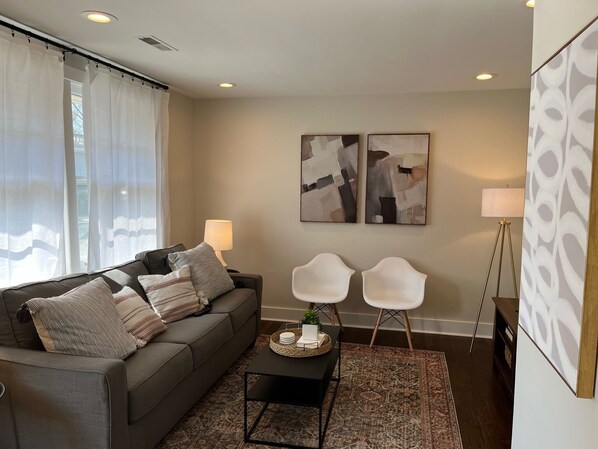 Living Room with Smart TV and Sofa Bed