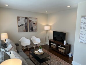 Living Room with Smart TV and Sofa Bed