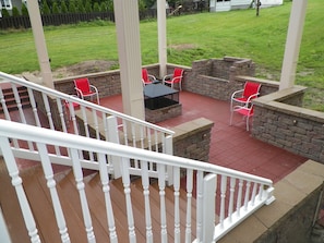 Large stone patio with custom built fire pit & grill. Plenty of seating for all!