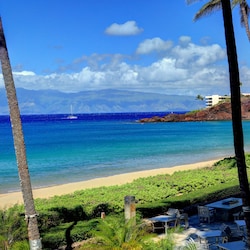 Sweeping views in every direction from the ocean front corner unit.