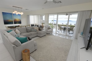 Huge bright living room looking out onto the beach and Caribbean Sea