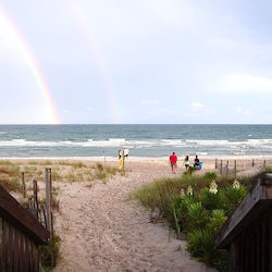 Wooden walkway to beach (2 houses to the left, 4 houses to the right) of house.