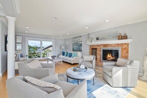Open living concept with a splash of modern coastal, great for socializing