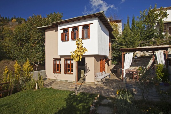 Villa DIONI with a flat garden and a cooling pool, ideal for hot days