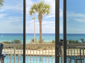 FLIP FLOPS FAMILY FUNSPOT has views of the pool and the deep blue sea. RELAX!