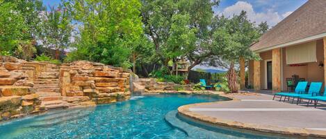 Gorgeous custom pool with waterfall and water slide!