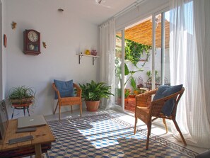 Lounge with large doors to patio