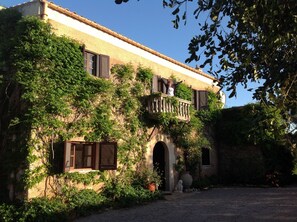 Front of our lovely old farm house. Judy on balcony.