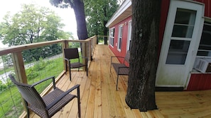 The new deck has plenty of space for several people to sit outside and visit.