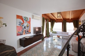 Living room with views on old town of Taormina and Mt Etna