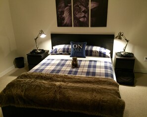 master bedroom with Queen and ensuite full bath and walk in closet 
