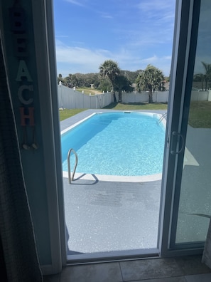 Looking out at the pool from the living room.