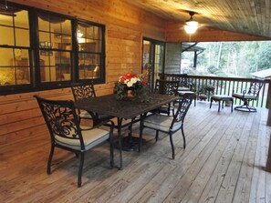 Large back deck area with seating for you and your guests!
