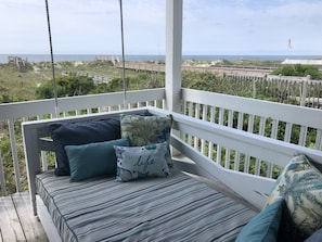 Relax to the sounds of the ocean on the back deck swing bed.
