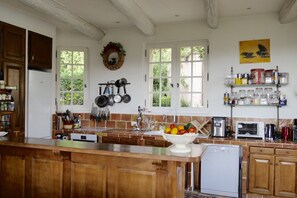 Kitchen. New appliances. Fireplace (cook w/ it!) & large dining table not shown