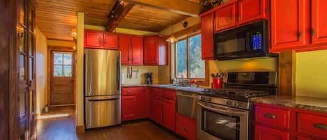 The powder pad's kitchen, featuring stainless steel appliances