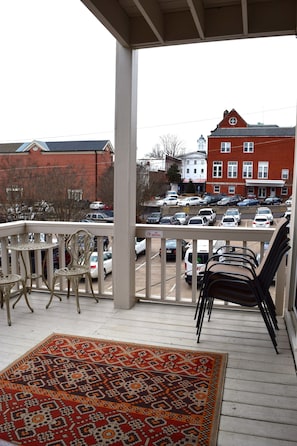 With a view of the Square, the downstairs balcony can seat up to 14 people.