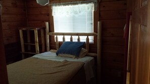 first floor queen bedroom with handmade log furniture
