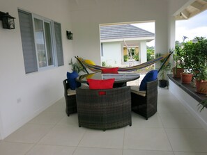 Veranda - space for eating and relaxing with hammock 