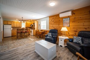 Enjoy relaxing on the leather lazy boy chairs &  heat pump/air conditioning