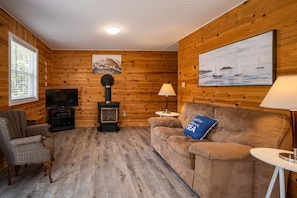 Living room with propane stove and TV
