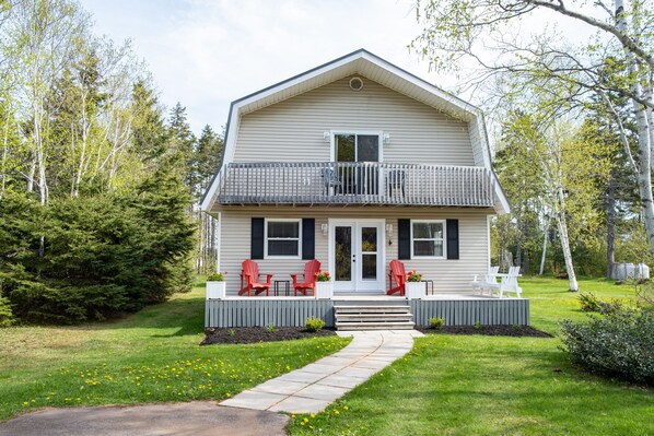 Enjoy the southern exposure deck on the Adirondack chairs and bench