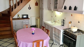 Fully equipped kitchen with large oven, dishwasher, microwave & butler sink.