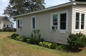 Back of the LITTLE HOUSE with sign