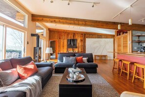 Living room with original artwork by Rick Smith, Don Drumm, and many more known artists and up and comers.