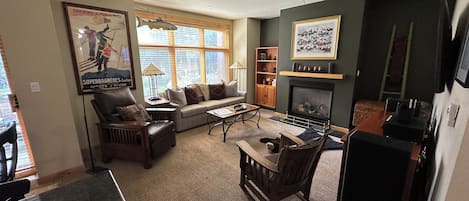Cozy Living Room wth fireplace, smart TV and great Stereo.