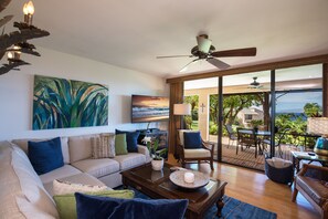 Ocean view from your living room, with super comfortable sectional  and new TV.