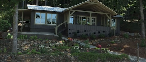 The cottage with our friend's wooden boat parked in front!