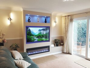 Bright, light living room with media wall