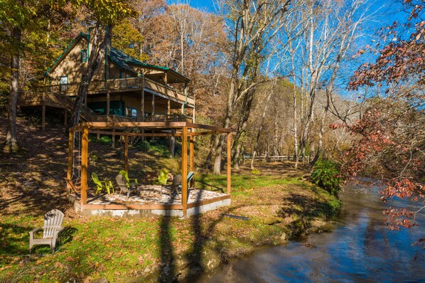 Fire pit area and creek frontage right outside your door!