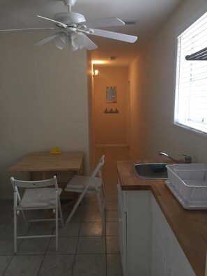 Eat in kitchen and view of the duplex’s entrance.