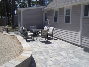 Large patio area in back yard.