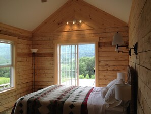 The master bedroom opens onto the deck