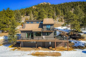 Front of House, hot tub to the right under the trees in huge granite boulders