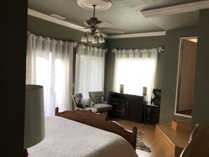 Master Bedroom, electric fireplace and door to the hot tub
