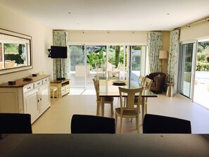 Open plan kitchen dining area with TV and satellite channels