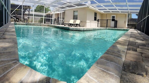 Take a dip in the pool, its screened in!