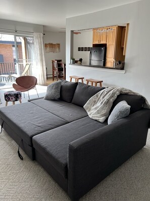 Sofa pulled out for extra sleeping space of just relaxing. Pre floor update.