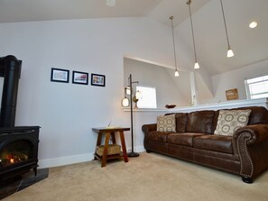 Living room area with gas fireplace.