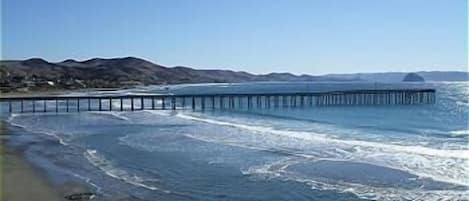 View of Cayucos Pier from condo deck.  Morro Rock can be seen in the background.