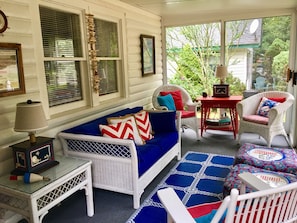 A perfect sunroom with sliding doors & screens on three sides