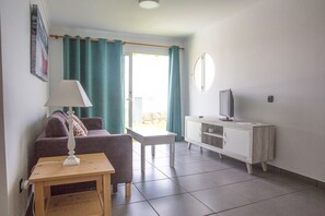 Salon with Flat Screen TV connecting to the outdoor area